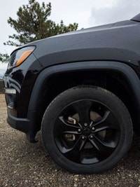 Step into the commanding presence of the 2018 Jeep Compass Altitude 4x4, cloaked in a stunning black... (image 6)