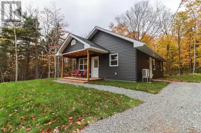 Just minutes from Hampton, NB, with its charming shops, amenities, and recreational opportunities, t...