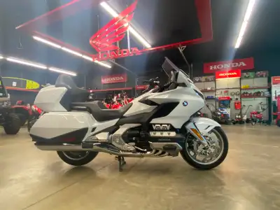 Double-wishbone front-suspension system w/ Showa shock absorber; 4.3 in. travel. (2) radially mounte...