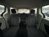 Experience the 2024 Chrysler Grand Caravan SXT in a pristine white finish, complete with efficient f... (image 7)
