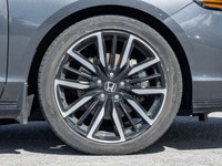 The 2024 Honda Accord Hybrid Touring commands attention in a refined Grey finish that highlights its... (image 3)