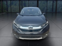 The 2018 Honda CR-V EX-L AWD in striking gray is the perfect blend of versatility and style, designe... (image 2)