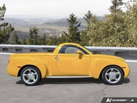Commanding presence meets open-air freedom in this stunning Slingshot Yellow 2004 Chevrolet SSR LS,... (image 5)