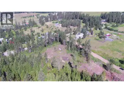 Rare 5.24-acre parcel in North BX, privately situated at the end of Ranch Road. Property includes a...