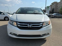2014 Honda Odyssey Touring — White exterior, Brown interior. This Odyssey is powered by a 3.5L V6 th... (image 1)
