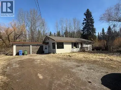 Very private 1.07 acres located in town. Rancher style home with 4 bdrms, large country kitchen with...