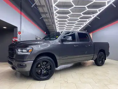 The 2022 Ram 1500 Sport 4x4 Crew Cab in a striking gray exterior is a vehicle crafted for those who...