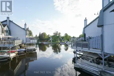 Welcome to This Beautiful End-Unit Waterfront Townhouse Featuring 3 Large Bedrooms & 4 Bathrooms. En...