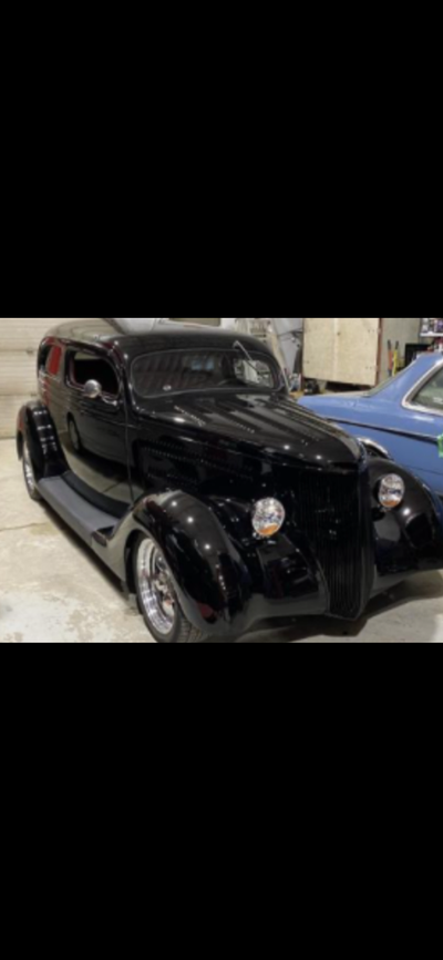 I am looking for information on this 1936 Ford two-door sedan. It is a complete car running sold in...