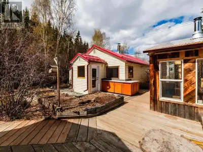 Tucked away on a private lot in the heart of downtown, this one-of-a-kind rustic downtown retreat bl...