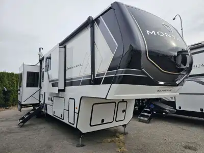 Keystone Montana fifth wheel 3901RK highlights: Rear Raised Kitchen Bath and a Half King Bed Firepla...