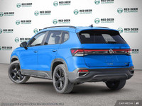 Introducing the 2025 Volkswagen Taos Comfortline Black Edition, a striking blue AWD SUV with an impe... (image 3)