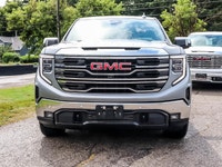 The 2023 GMC Sierra 1500 SLT Crew Cab Short Box 4-Wheel Drive in a refined gray finish offers except... (image 1)