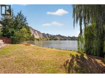 One of the last remaining freehold waterfront parcels on Okanagan Lake! This private piece of absolu...