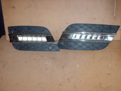 Slightly used O.E. "Day Time Running Light" assembly (light, moulding, frame), left OR right in NEW...