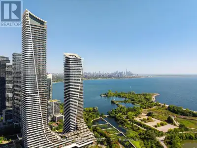 Waterfront Corner Condo With Panoramic Lake & Skyline Views! Welcome to this spectacular corner unit...