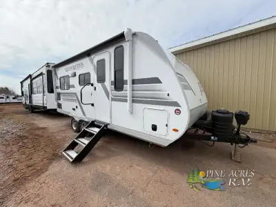 Heartland North Trail travel trailer 190MB highlights: Theater Seat Slide Out Two Wardrobe/Nightstan...