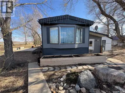 Located just 13 minutes east of Weyburn along Highway 13, this well-maintained 4-bedroom home sits o...