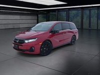 The 2025 Honda Odyssey Black Edition in a striking Red finish, equipped with a Front-Wheel Drive, of... (image 3)