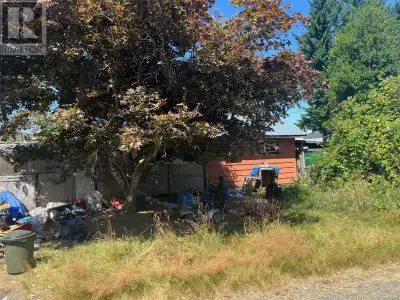 Here is an opportunity to own a commercial lot which provides both street frontage and lane access....