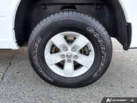 This commanding 2023 Ram 1500 Classic SLT Crew Cab Pickup, shimmering in Bright White with a functio... (image 6)