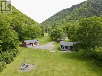 Nestled deep in the hills along two-thirds of a mile of the legendary Margaree River, this extraordi...