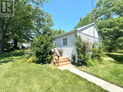 Located on a quiet stretch of Riverside Drive and directly across from the water, this 2-bedroom hom...