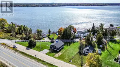 4-SEASON ORR LAKE BUNGALOW WITH TWO PROPERTIES, EXTENSIVE UPDATES & 100+ FT OF SUN-SOAKED SHORELINE!...