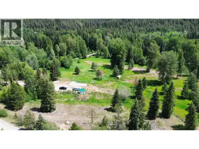 Large, open, and level 5.93 acre lot featuring a prepared building site with a ready-to-go septic sy...