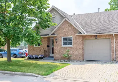 Elegant End Unit Bungalow Townhome with open concept design. Located in sought-after Orchardview Vil...