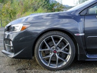 Feel the thrill of the road with the 2017 Subaru WRX STI Sport, finished in a striking shade of gray... (image 7)