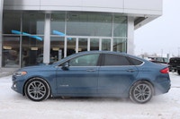 Capital Ford Lincoln Winnipeg Ltd (MB's #1 Rated Ford Store) This 2019 Blue Ford Fusion is a stunner... (image 1)