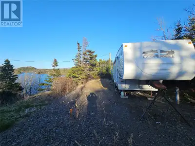 Set atop a hill and running down to the ocean, this 1 acre (approx) lot has community water, septic...