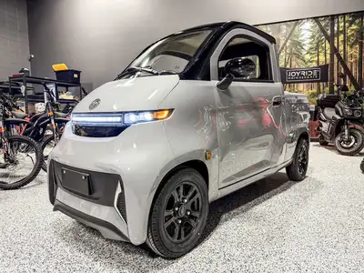 Skip the gas and roll out in an enclosed electric vehicle that works like a mini pickupheated cabin...