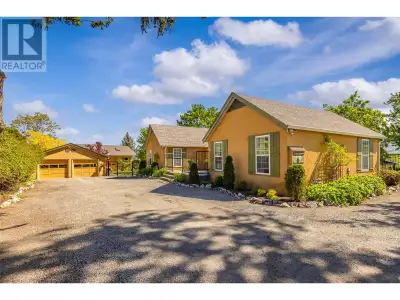 Nestled down a private drive behind an automated gate, this .75 acre remarkable property harmonizes...