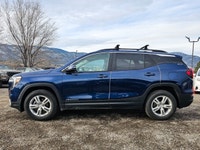 The 2022 GMC Terrain AWD SLE in a captivating Blue shade and equipped with an AWD drivetrain deliver... (image 3)