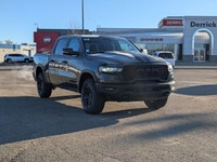 The 2026 Ram 1500 Rebel Crew Cab in Granite Crystal Metallic makes a bold statement with its rugged... (image 8)