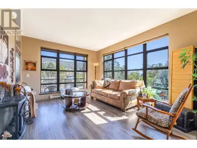 Bright Top Floor corner unit facing South East to Skaha Beach get Lots of morning sun with the tall...