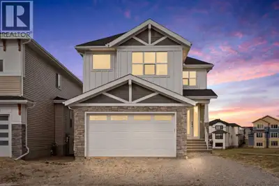 Welcome to 294 Kinniburgh Loop — a stunning 3,410 sq. ft. of finished luxury living, perfectly posit...