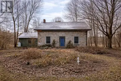 Step back in time while embracing natures beauty at this circa 1860 stone home, perfectly set on jus...