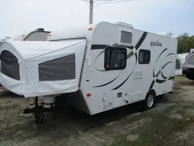 A lightweight hybrid trailer with two 54” x 74” tent end beds , fold down dinette , side bath w/ tub...
