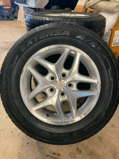 4 DODGE RIMS & TIRES. Rims are in excellent condition. Very Clean, Tires still have 60% tread left o...