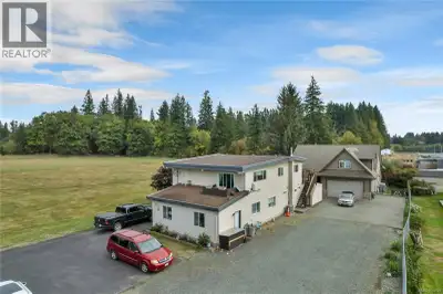 Investor Alert!! Unique offering with 2 homes and 3 legally zoned suites on nearly half an acre cent...