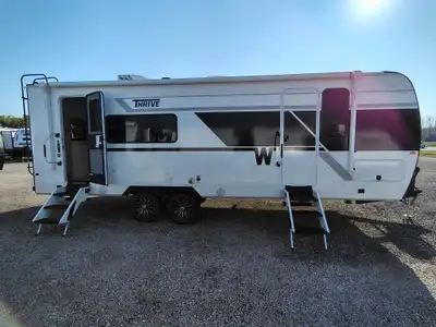 The Thrive™ lightweight travel trailer redefines glamping with sleek design, residential comforts, a...