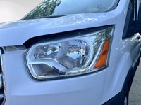 The 2017 Ford Transit Cargo Van in white with an automatic transmission and RWD drivetrain is specif... (image 6)