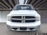 This commanding 2023 Ram 1500 Classic SLT Crew Cab Pickup, shimmering in Bright White with a functio... (image 1)