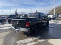 Calling all enthusiasts for this stunning and agile 2014 Ram 1500 ST. Take pleasure in the quick shi... (image 4)