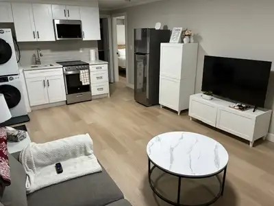 Clean 1 bedroom modern Furnished basement suite with own laundry and private entrance with mini pati...