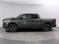 The 2026 Ram 1500 Sport, presented in a sophisticated gray finish, offers powerful 44 capabilities c... (image 1)