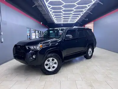Experience the rugged elegance of the 2016 Toyota 4Runner SR5, presented in a commanding Black finis...
